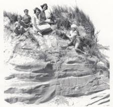 Historical Photo of a family posing on a sand dune.